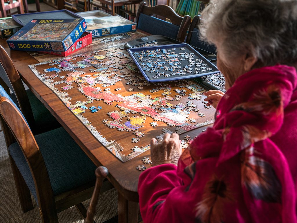 Resident doing a jigsaw puzzle