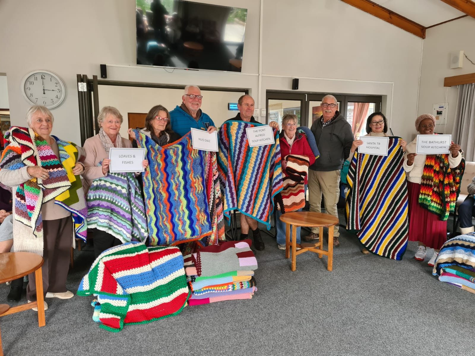 Residents with handmade charity blankets
