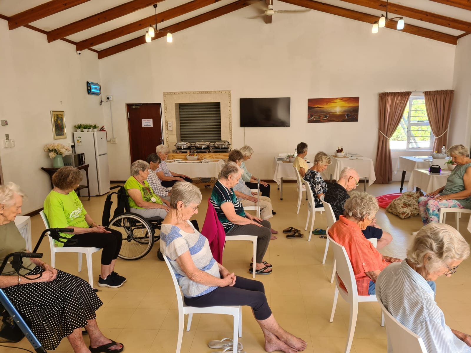 Residents in a seated exercise class